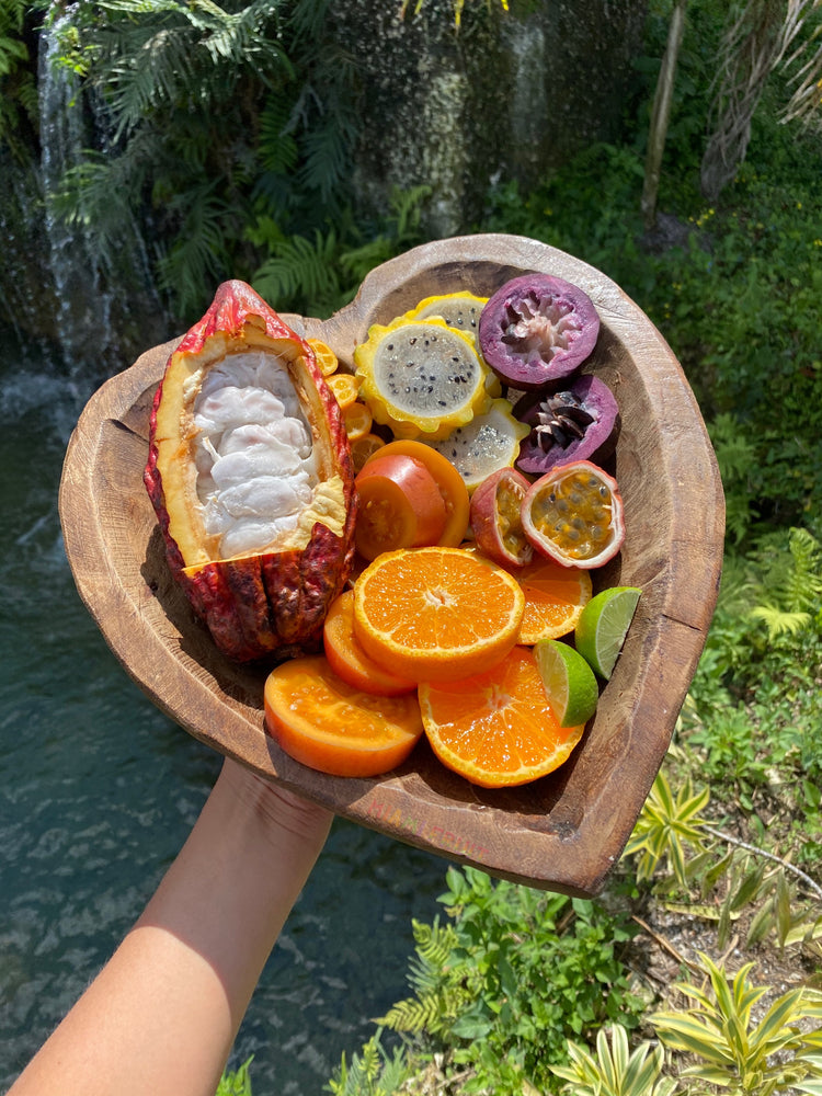 tropical fruit bowl platter with cacao, mandarin, tree tomato, passionfruit, kumquat, yellow dragonfruit, and star apple
